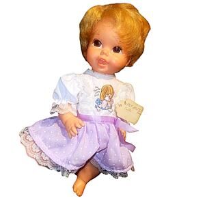 Charming  1970 "Tiny Chatty Baby" Baby Doll with captivating brown eyes.